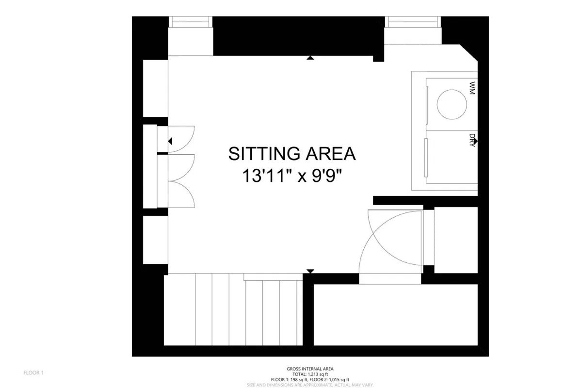 An intimate sitting area adjacent to a staircase and kitchenette, with soft lighting and inviting seating for small groups or quiet reflection. The space is ideal for enjoying a coffee while mapping out day trips or sharing stories from the day's adventures.